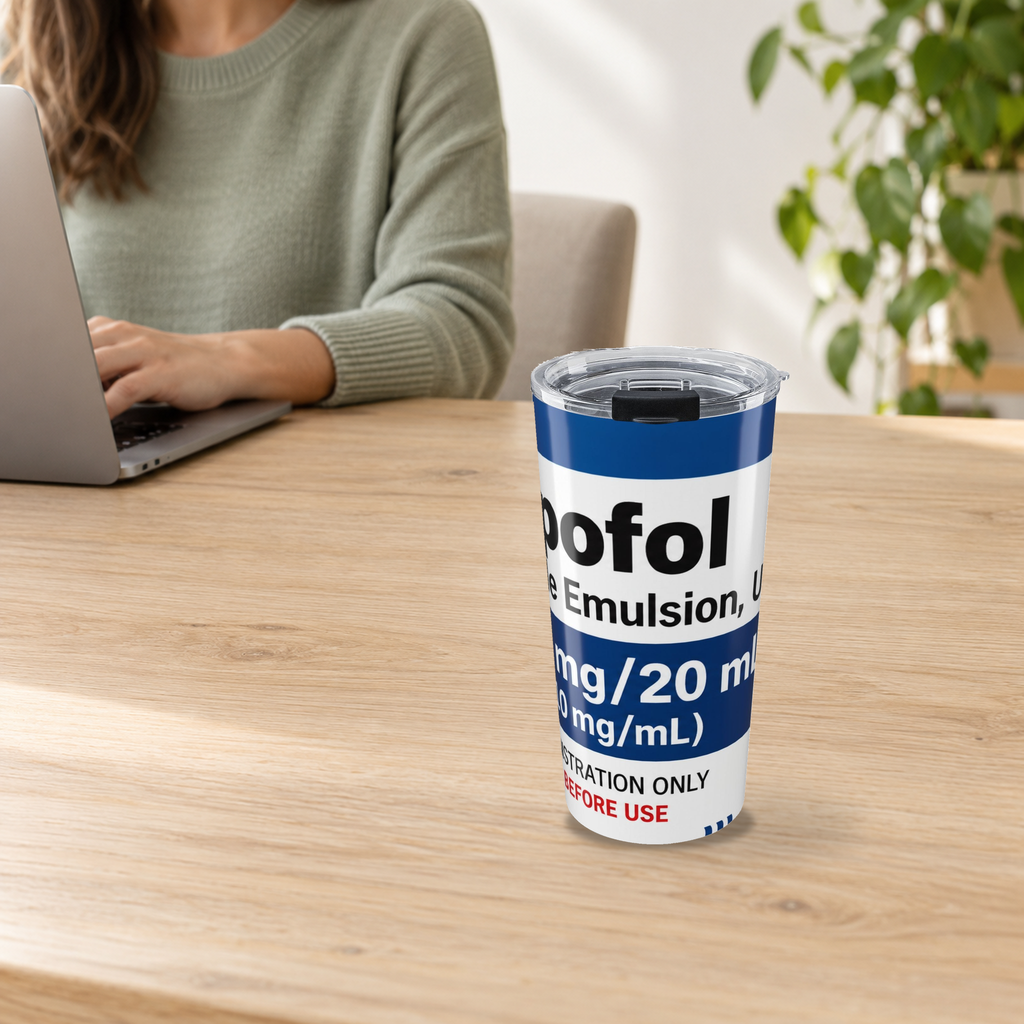 Novelty 20oz tumbler with Propofol-inspired print on a wooden desk beside an adult using a laptop