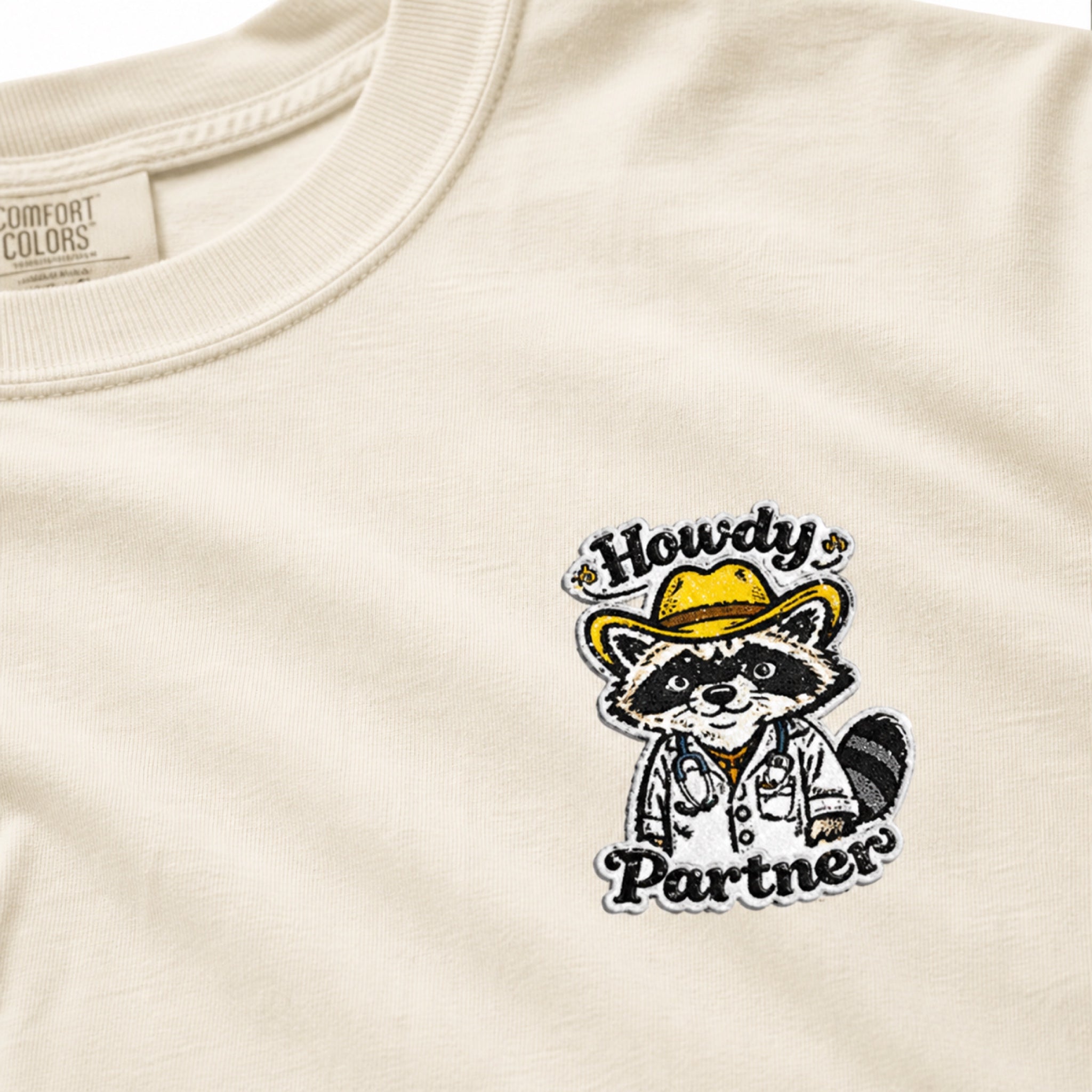 Howdy Partner Raccoon Comfort Colors T-Shirt | Western Medical Tee