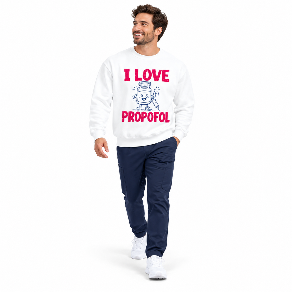 Healthcare professional walking in a white I Love Propofol sweatshirt with scrub pants on a white background
