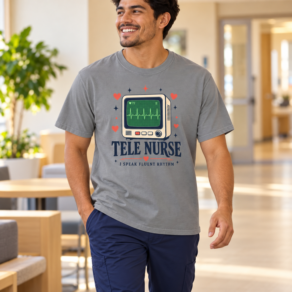 Telemetry nurse wearing a Grey Tele Nurse Fluent Rhythm tee and navy scrub trousers in a warm medical staff lounge