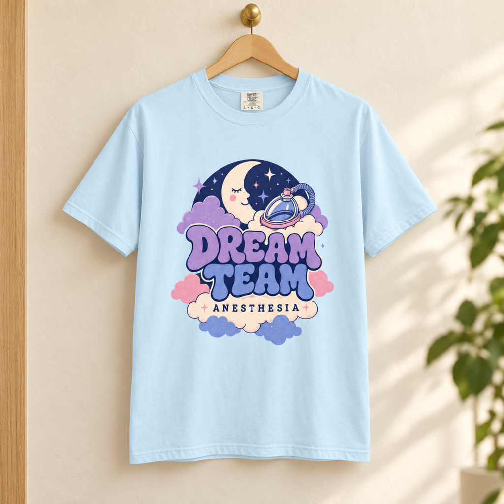 Chambray Dream Team Anesthesia tee on a hanger in a tidy warm medical lounge
