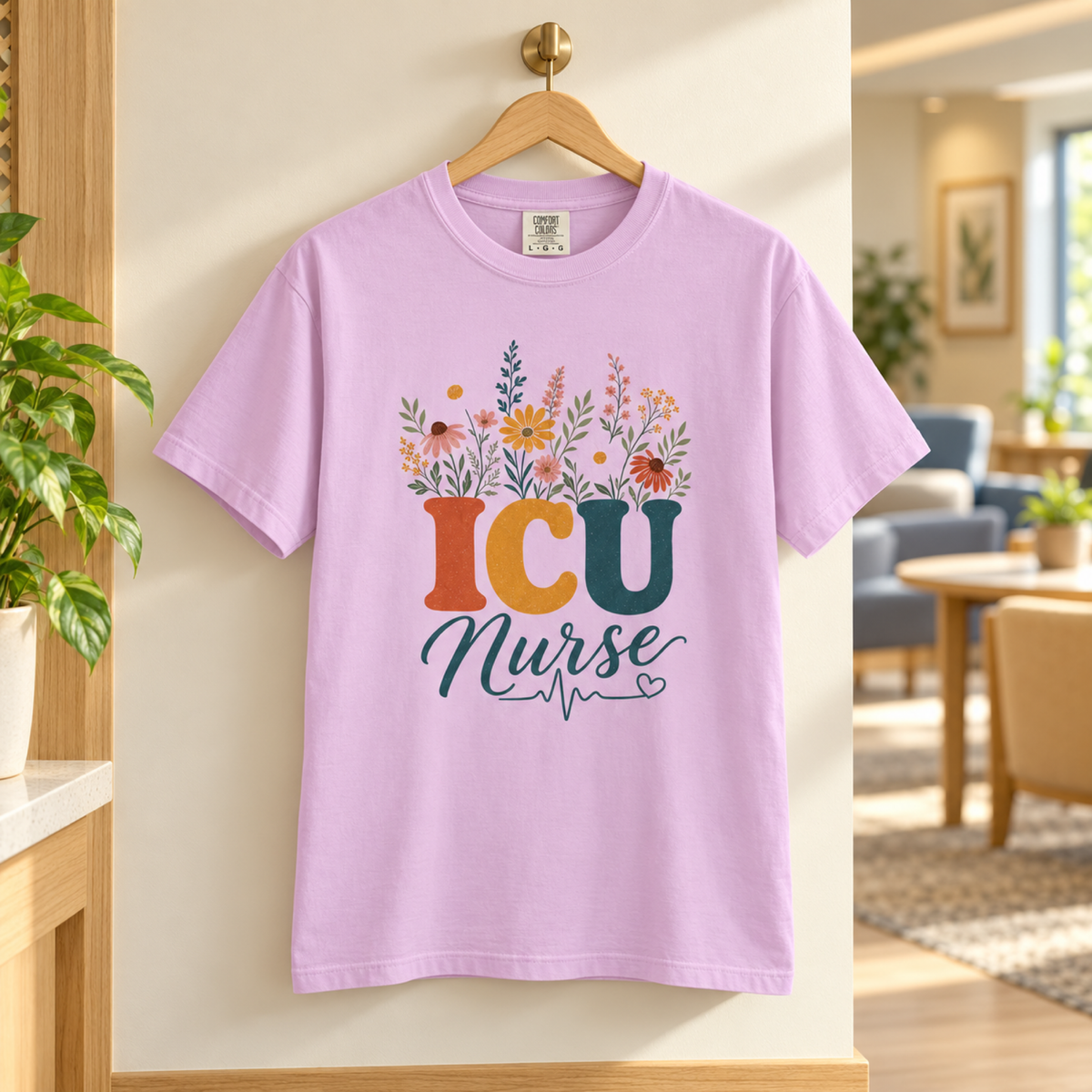 Orchid purple wildflower ICU Nurse tee on a wooden hanger in a warm hospital staff lounge