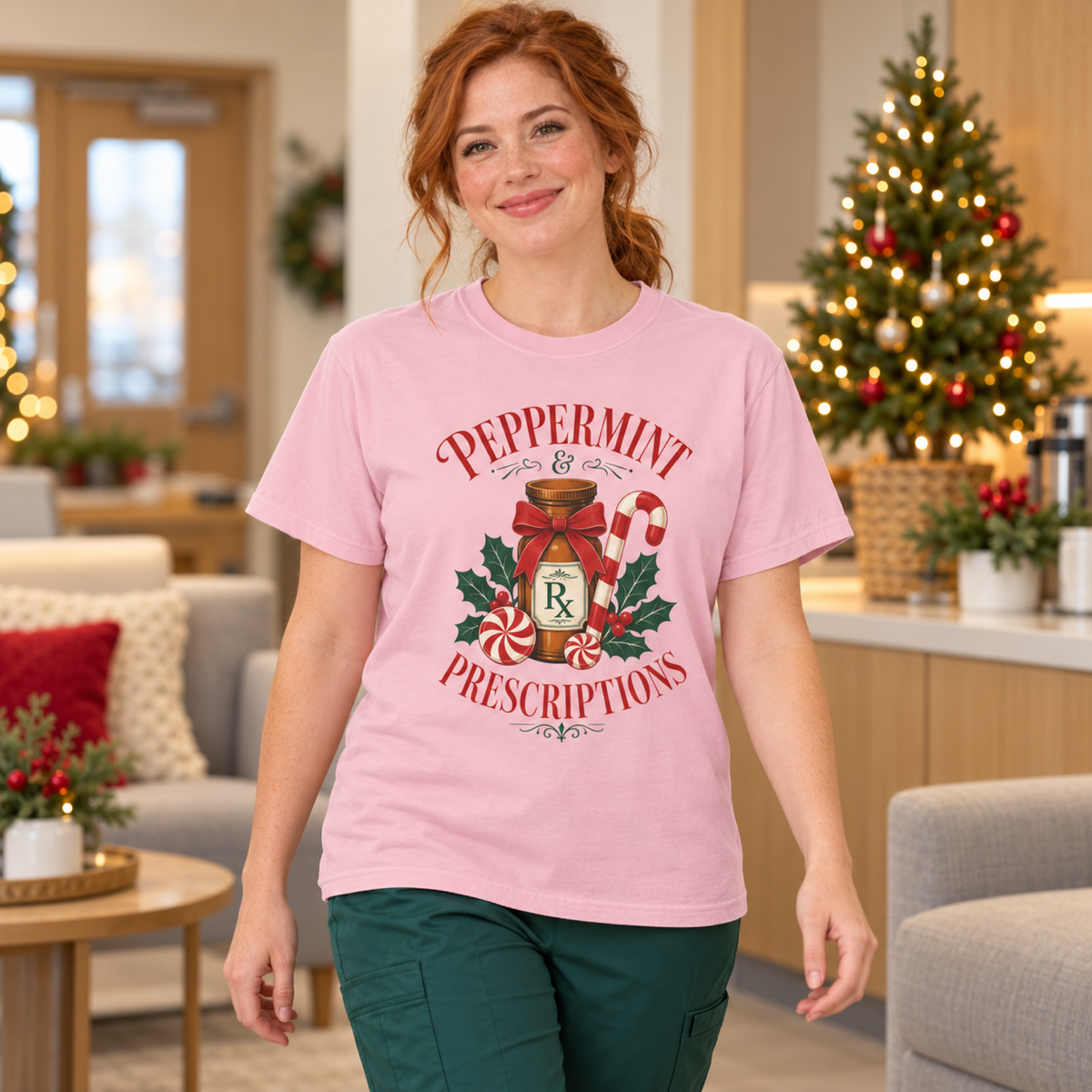 Healthcare professional wearing a Blossom Peppermint and Prescriptions tee with green scrub trousers in a cozy Christmas staff lounge