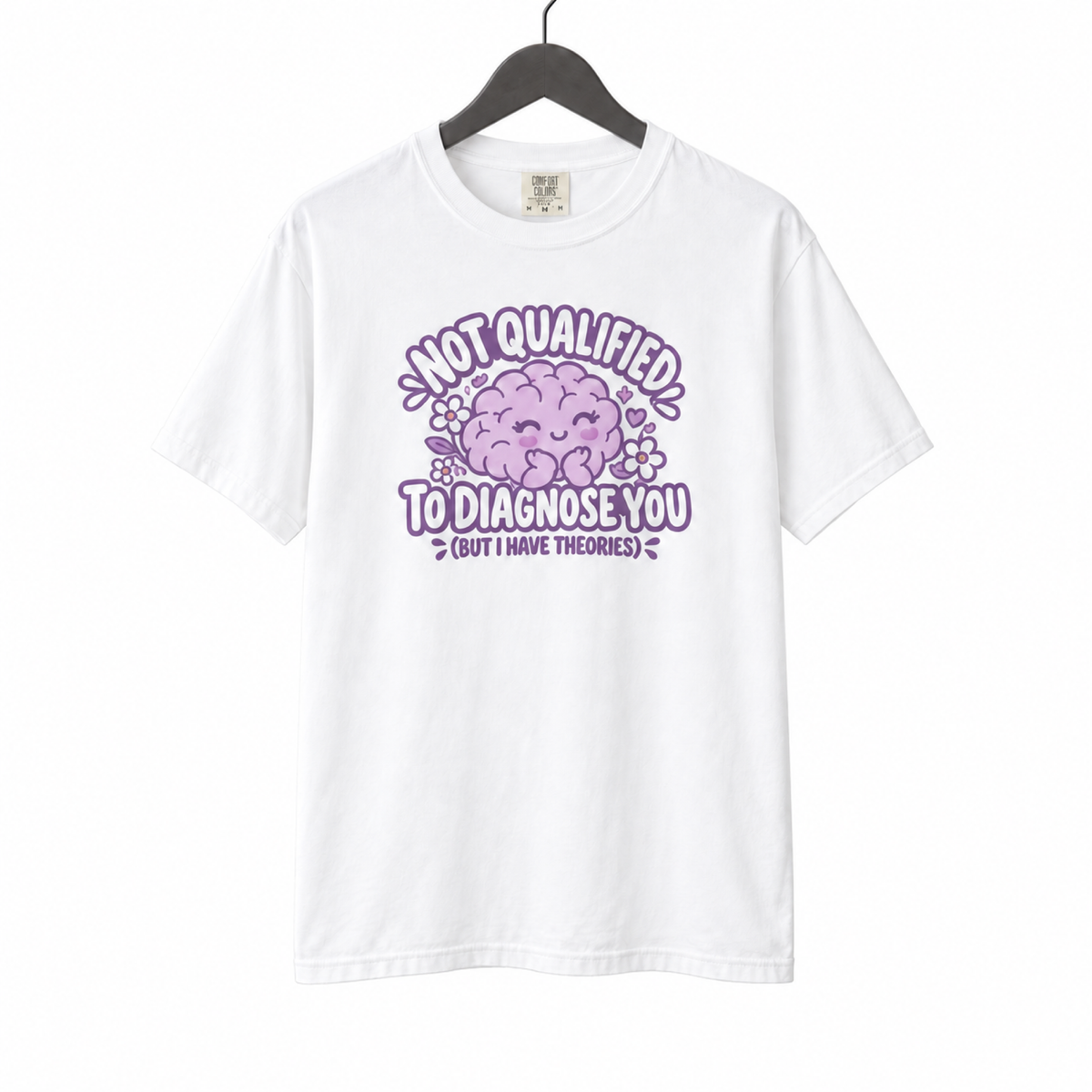 Not Qualified to Diagnose You Shirt on a hanger against a white background
