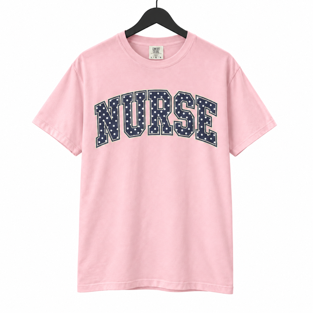 Nurse Polka Dot Varsity shirt on hanger against a pure white background