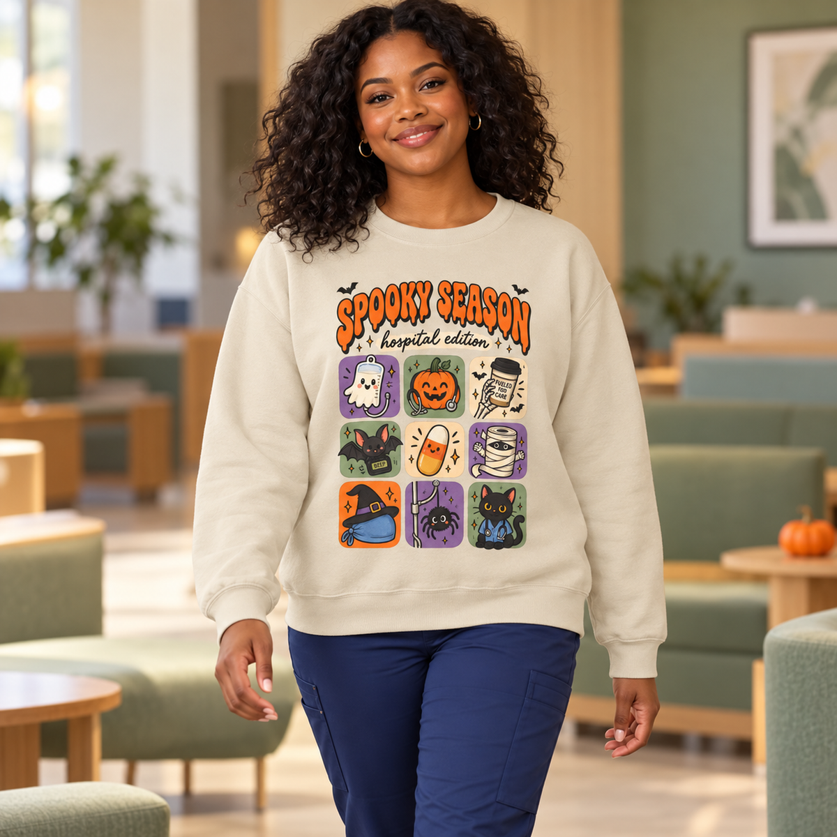 Spooky Season Hospital Edition Sweatshirt in Sand — model in warm medical setting