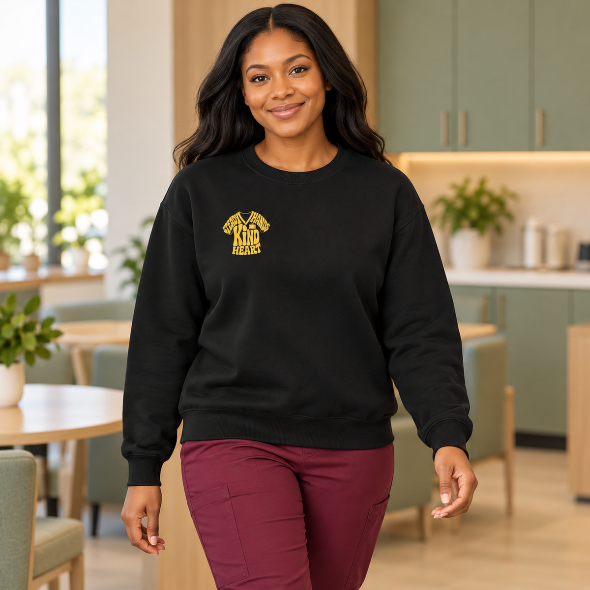 Steady Hands Kind Heart Sweatshirt, Nurse Crewneck, Healthcare Worker Gift in Black — model in warm medical setting