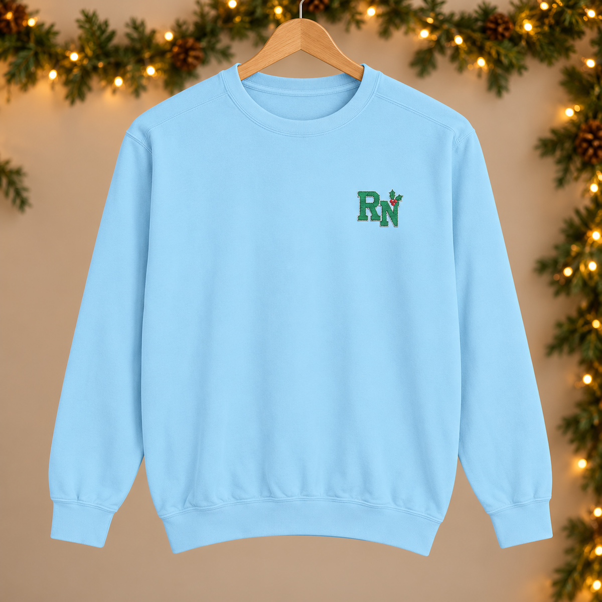 RN Holly Embroidered Sweatshirt, Comfort Colors Christmas Nurse Crewneck in Chambray — product in warm setting