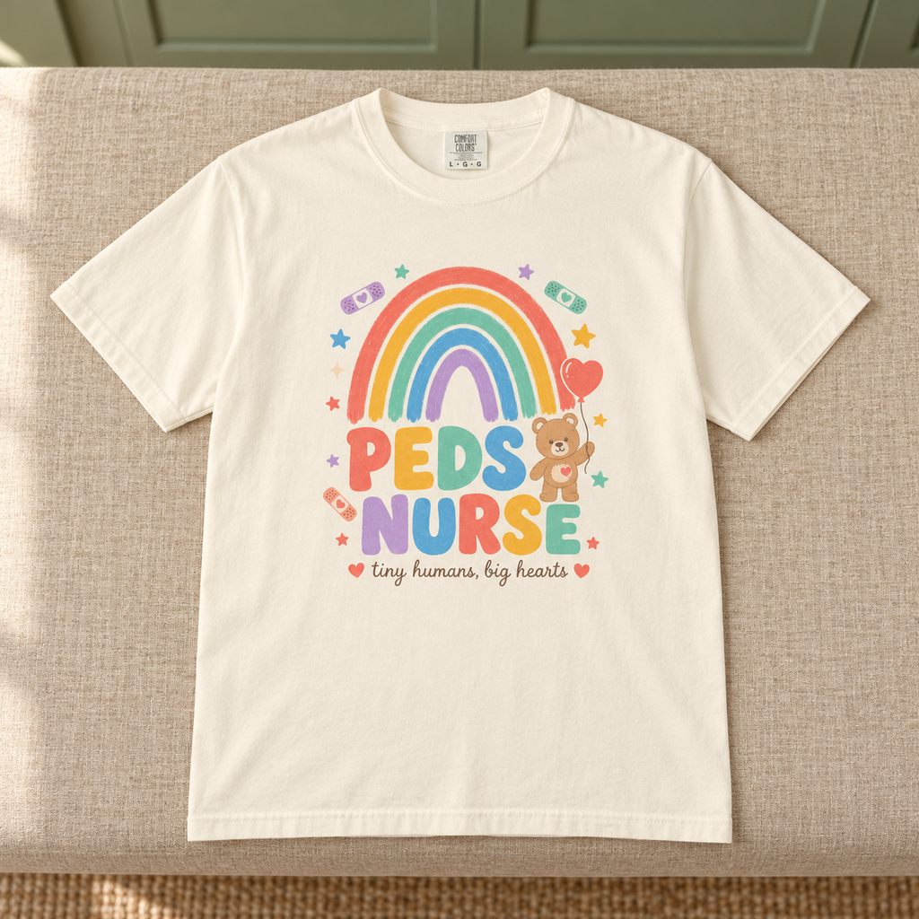 Peds Nurse Shirt, Tiny Humans Big Hearts Comfort Colors Tee in Ivory — product in warm setting