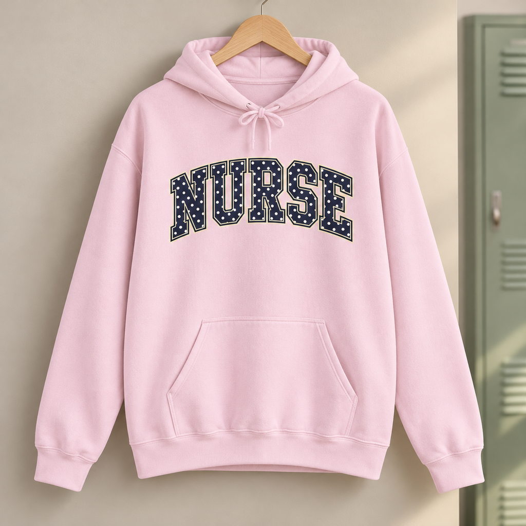 Nurse Polka Dot Varsity Hoodie in Light Pink — product in warm setting