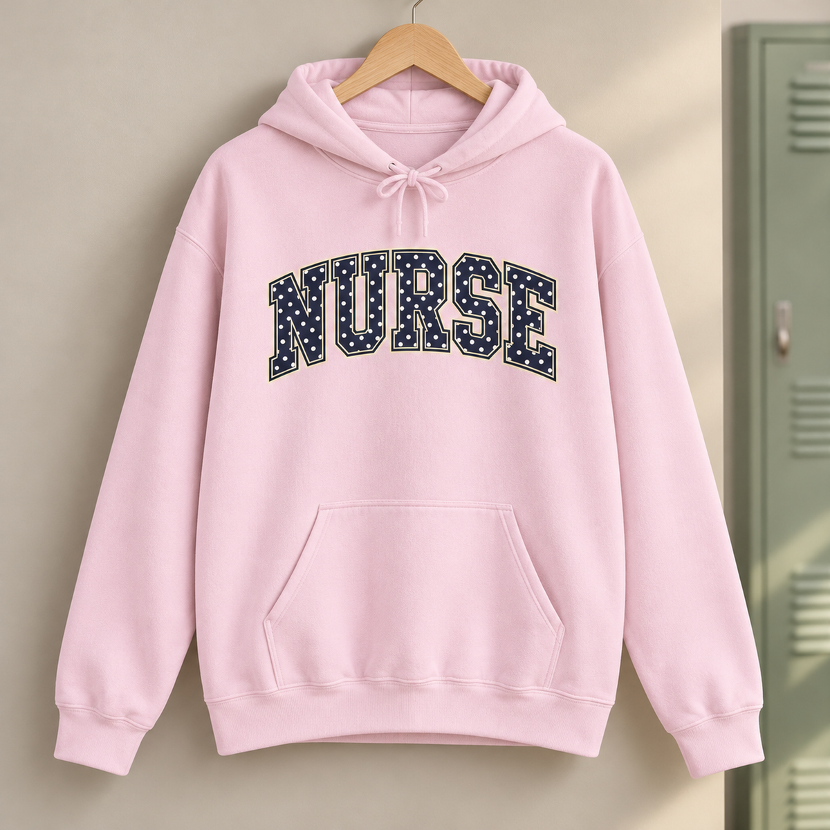 Nurse Polka Dot Varsity Hoodie in Light Pink — product in warm setting