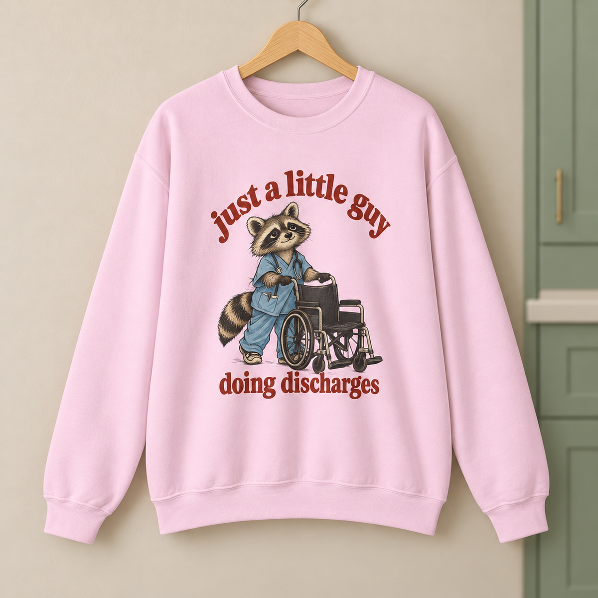 Just a Little Guy Doing Discharges Sweatshirt in Light Pink — product in warm setting