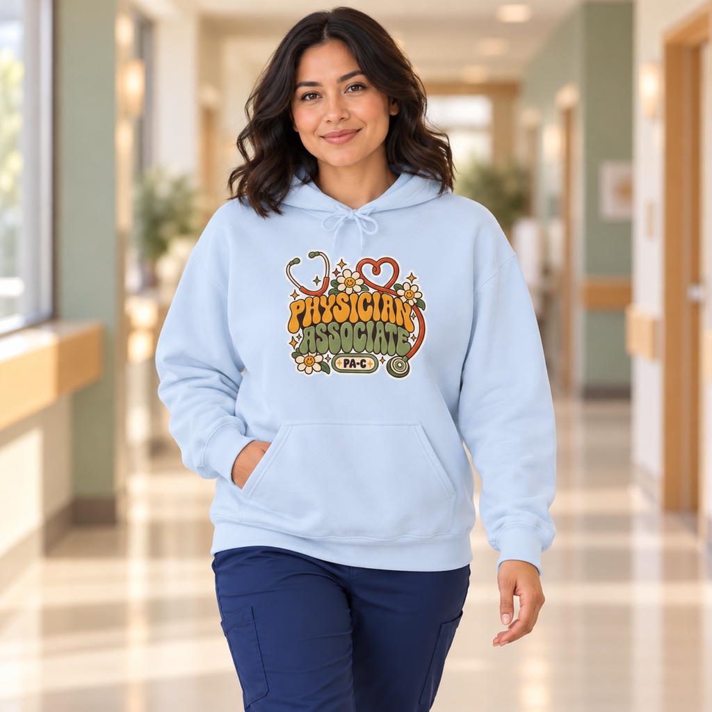 Physician Associate Retro Groovy Hoodie in Light Blue — model in warm medical setting