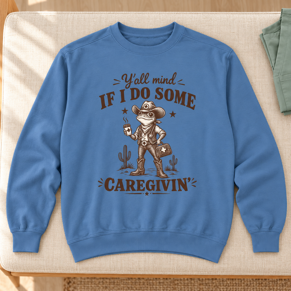 Y'all Mind If I Do Some Caregivin' Cowboy Frog Sweatshirt — product cover in a calm medical setting