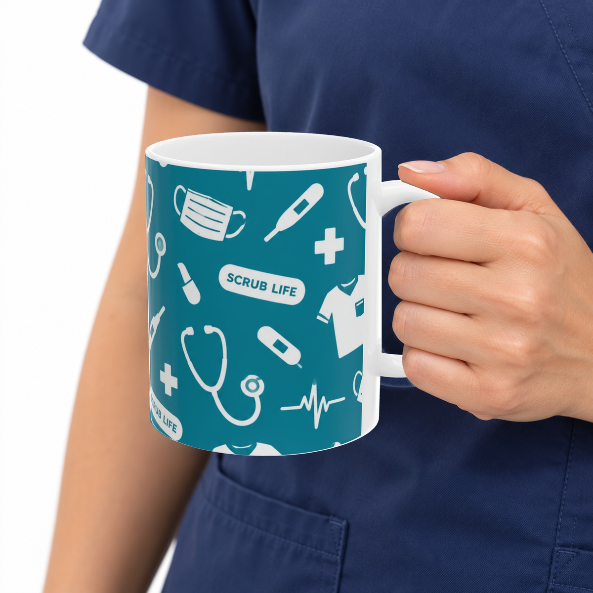 Scrub Life medical pattern 11oz mug held by a person wearing navy scrubs, with the original teal and white product design